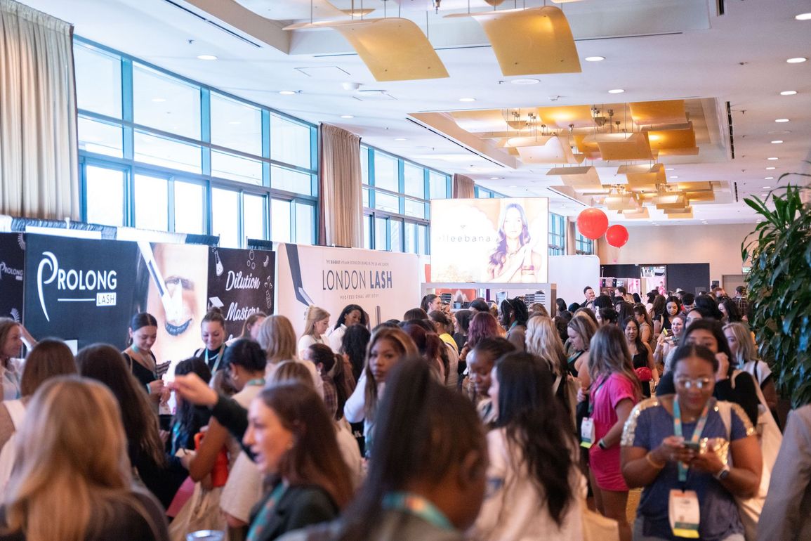 A large group of people are gathered in a large room.