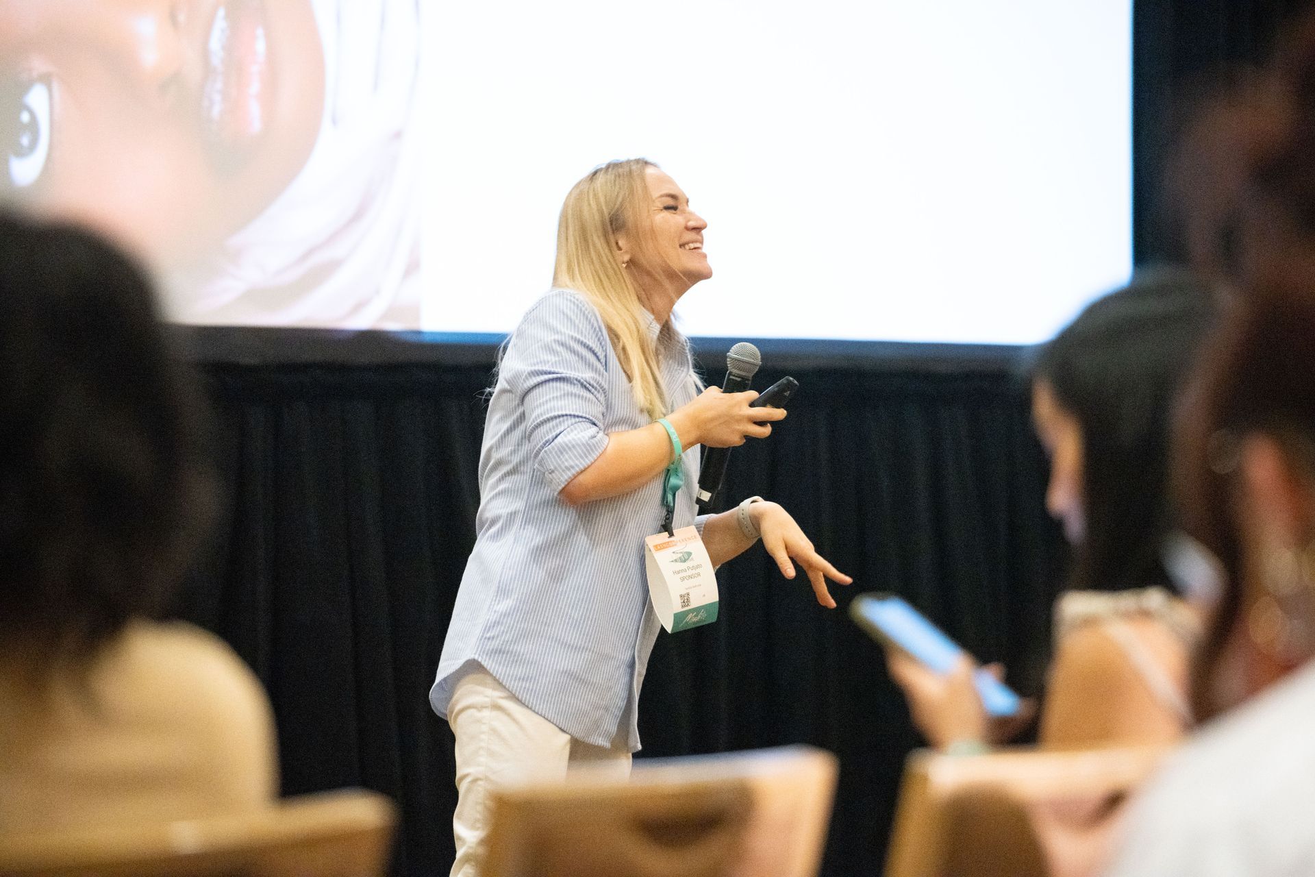 A woman is giving a presentation to a group of people.