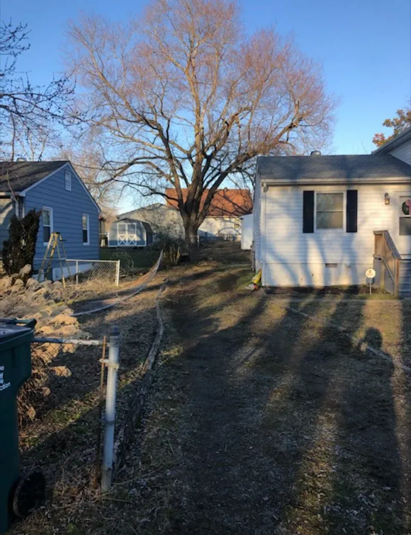 A Dirt Road With Houses On Either Side Of It - Charles City, VA - Bottoms Bridge Tree Service