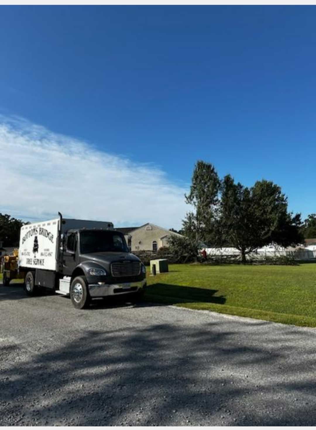 A truck is parked on the side of the road