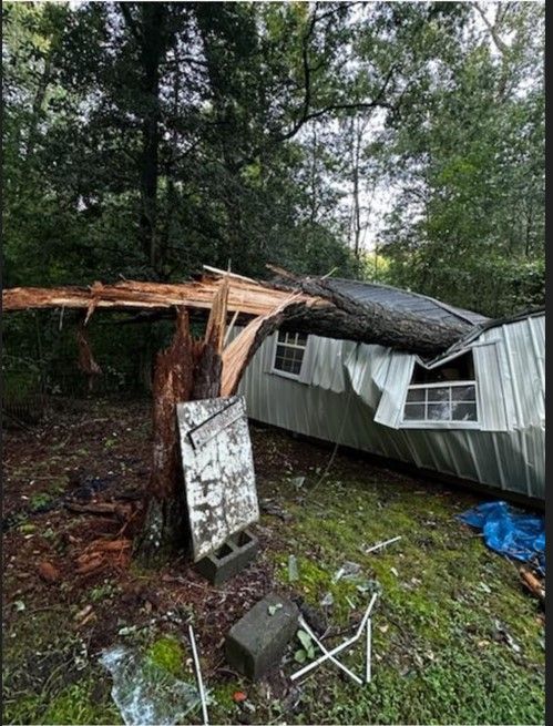 A mobile home that has been damaged by a storm.