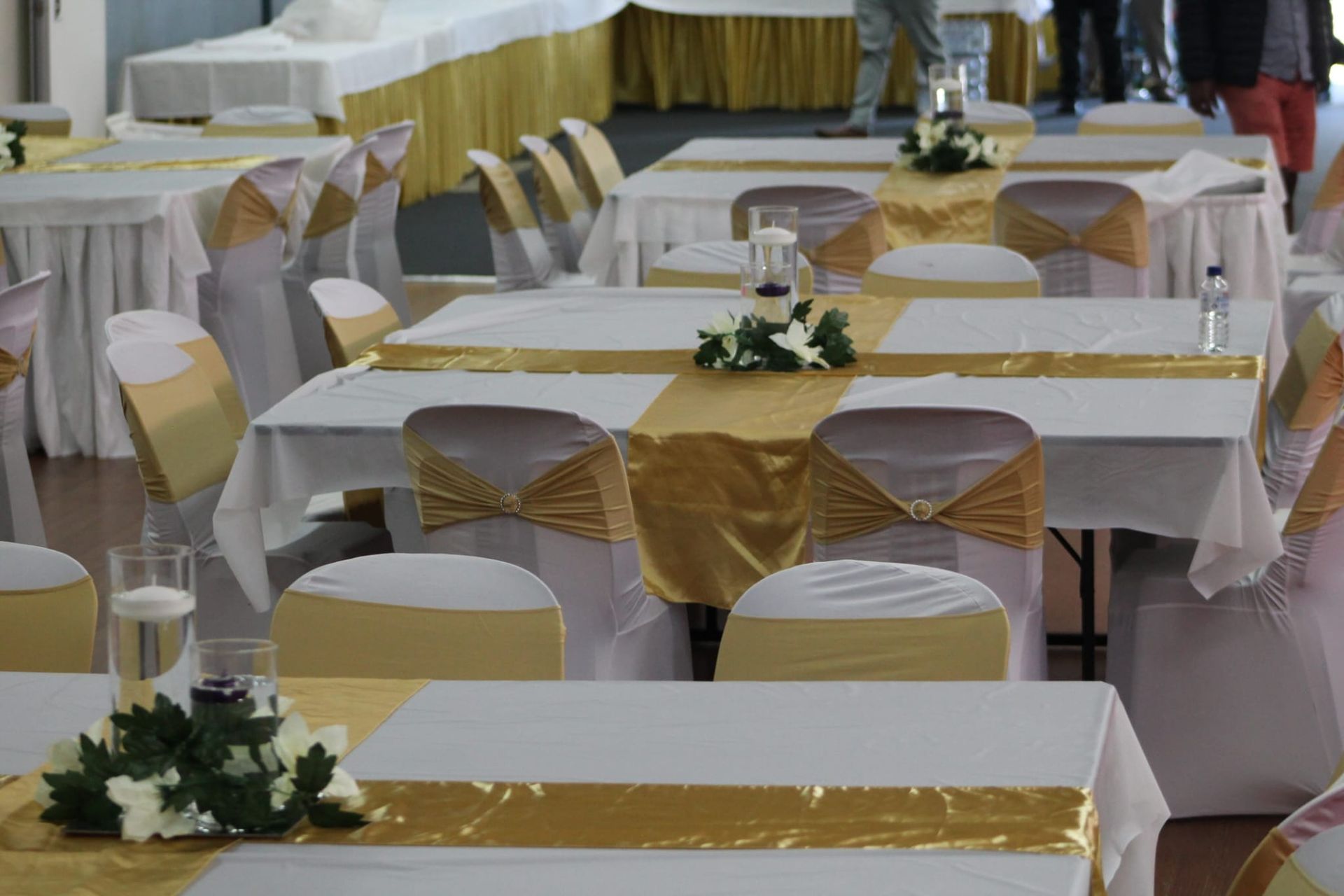 Tables and chairs are set up for a wedding reception