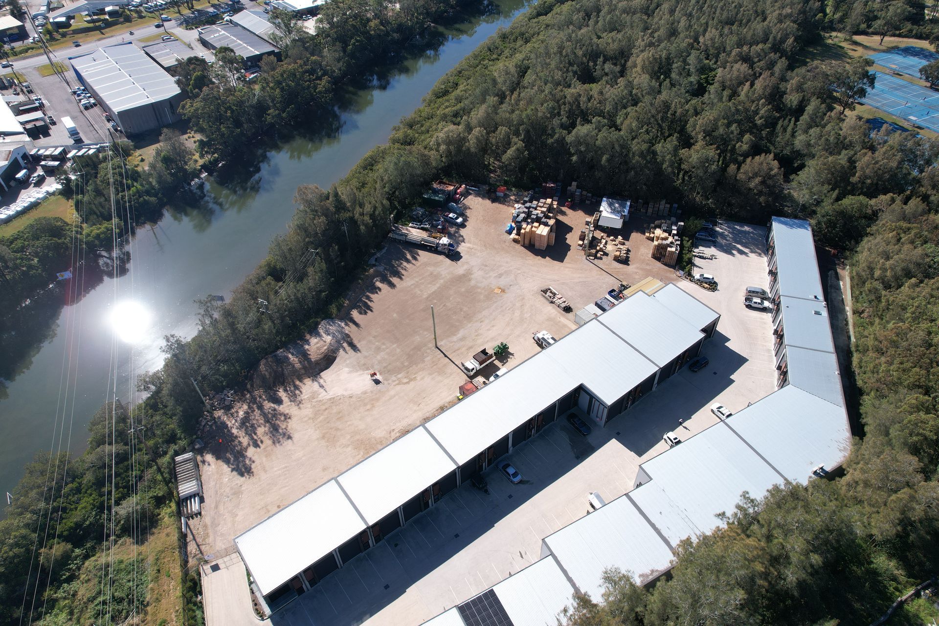 A Row of Trailers Parked Next to Each Other on A Lush Green Field —  Central Coast Storage Solutions in West Gosford, NSW