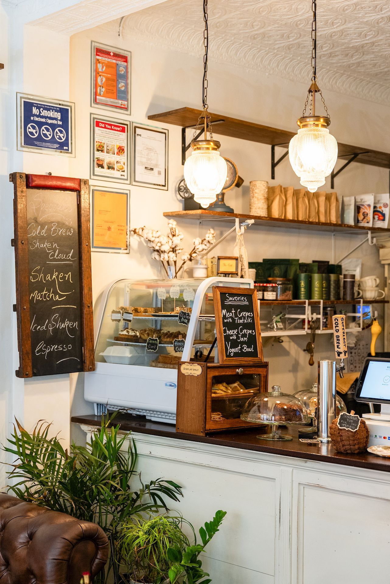 A restaurant with a counter and a display case.