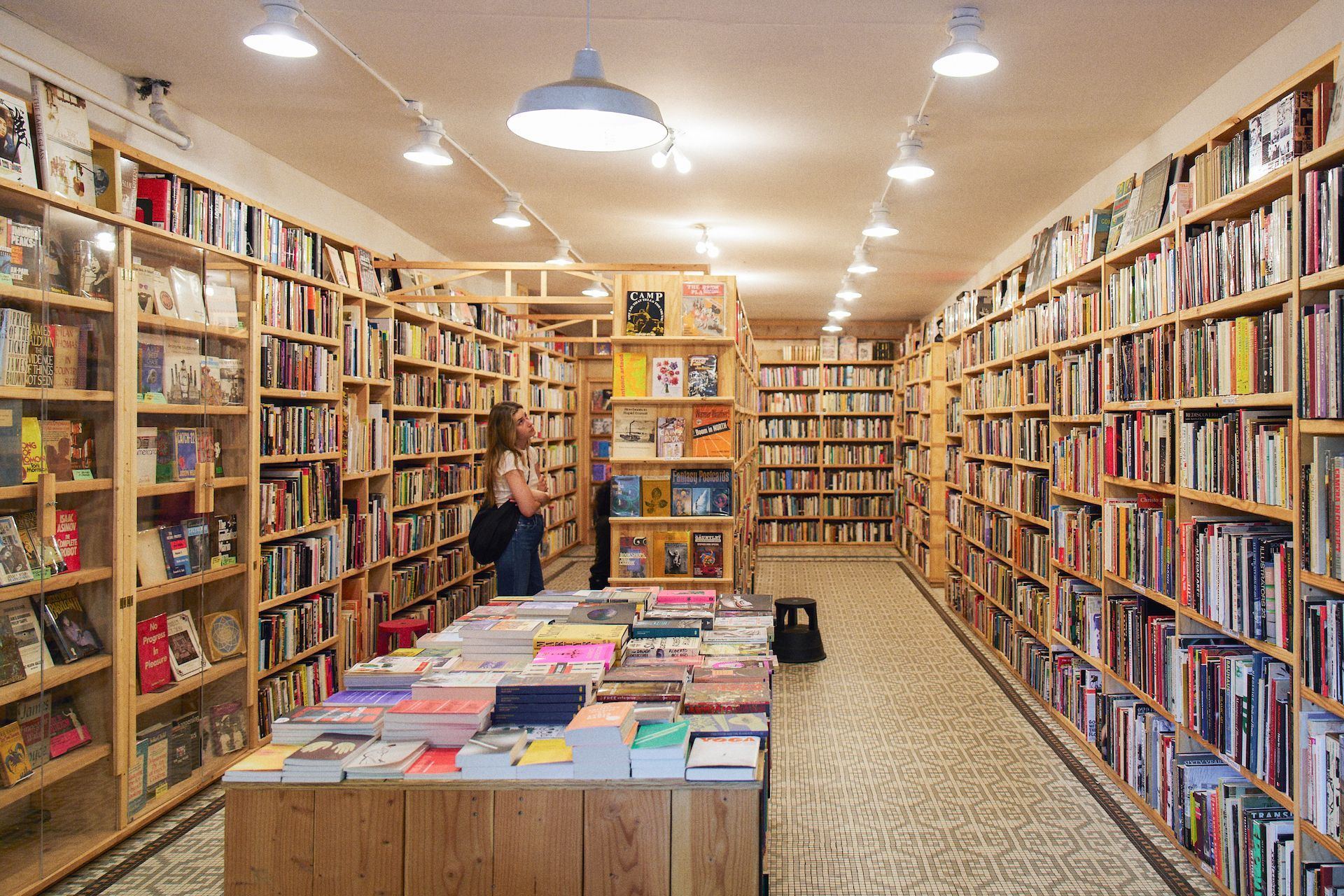 A bookstore filled with lots of books and shelves.