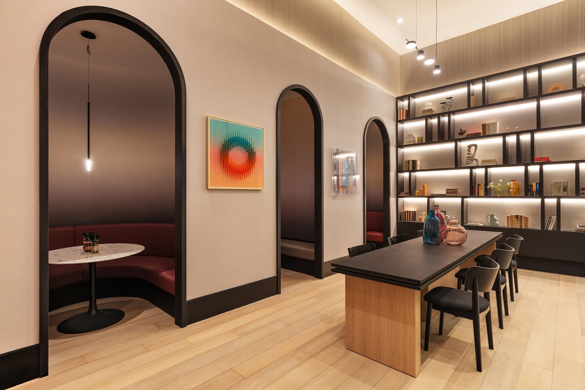 A large room with a table and chairs in it