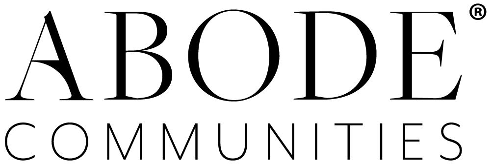 the abode communities logo is black and white on a white background .