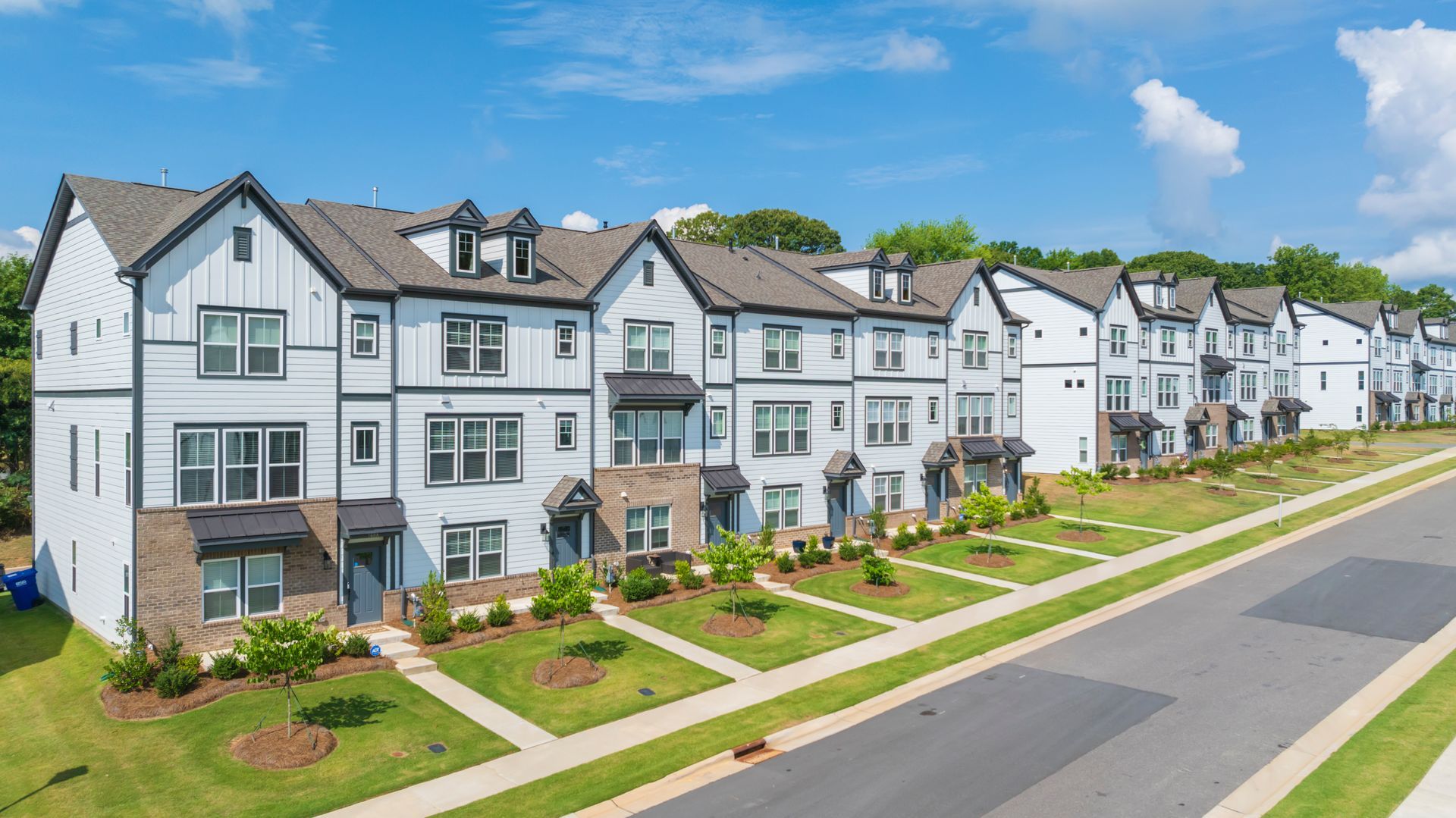 an aerial view of a row of apartment buildings .