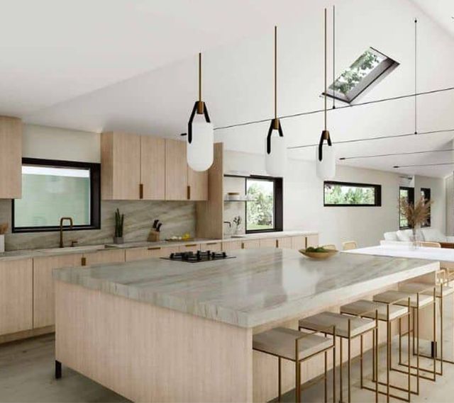 A kitchen with a large island and stools