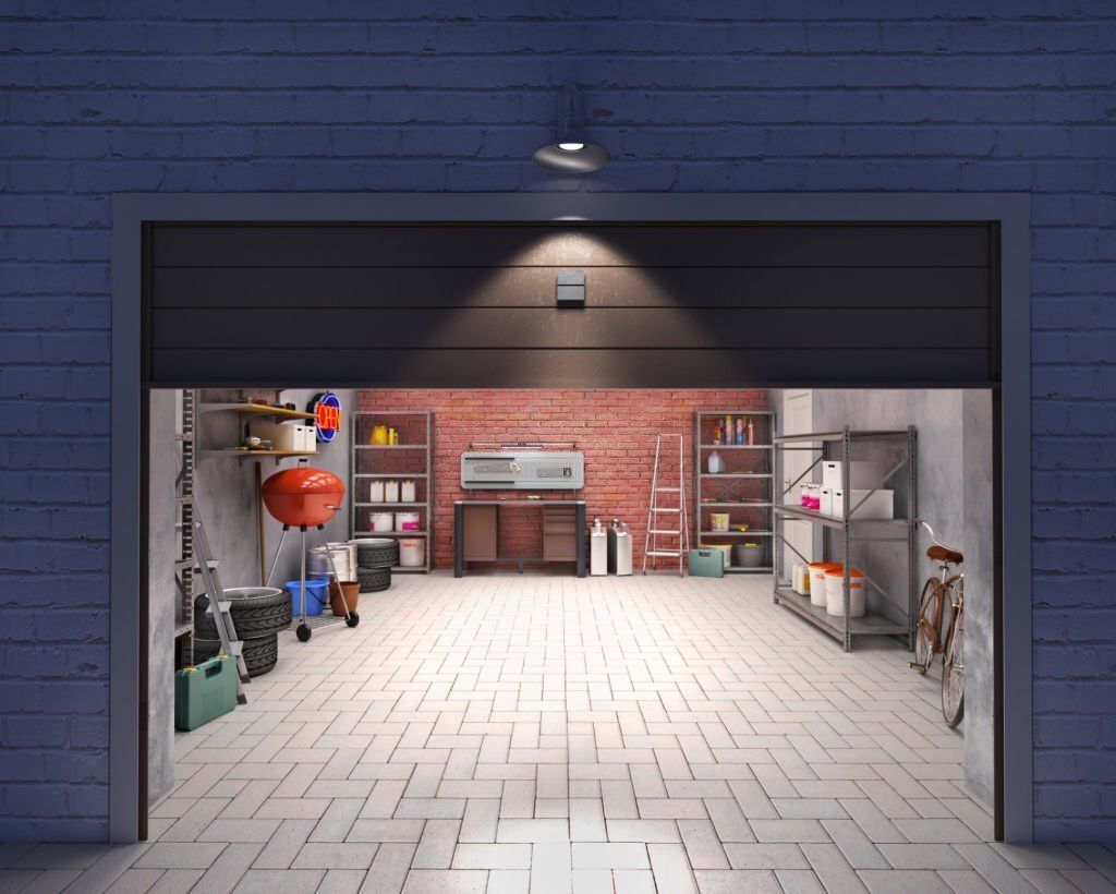 A garage with a garage door open and a brick wall.