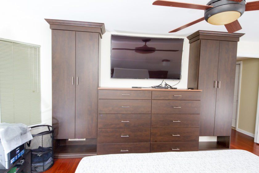 This chocolate pear colored bedroom built-in includes plenty of drawer space and enclosed shelves shelves. Looks beautiful surrounding the big screen TV.
