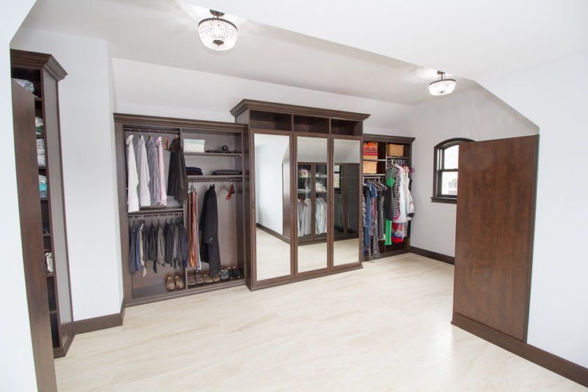 This large dream closet in Rockland County, NY has plenty of space and a 3-way mirror so you can see all sides of your outfit!