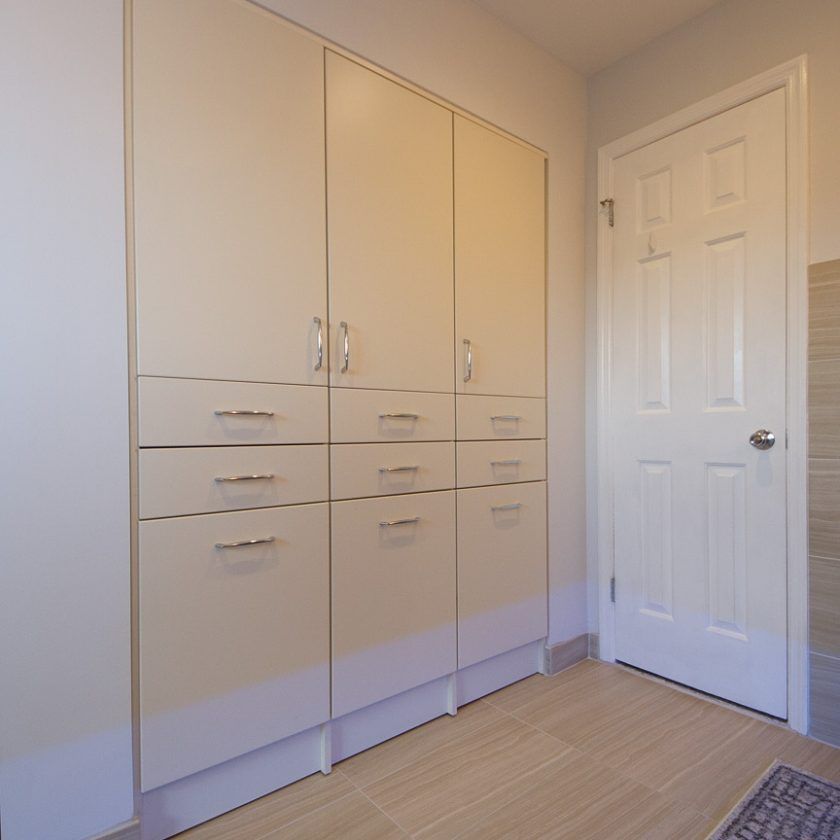 This contemporary bathroom built-in has 3 hampers, drawers and plenty of storage for towels and medicine