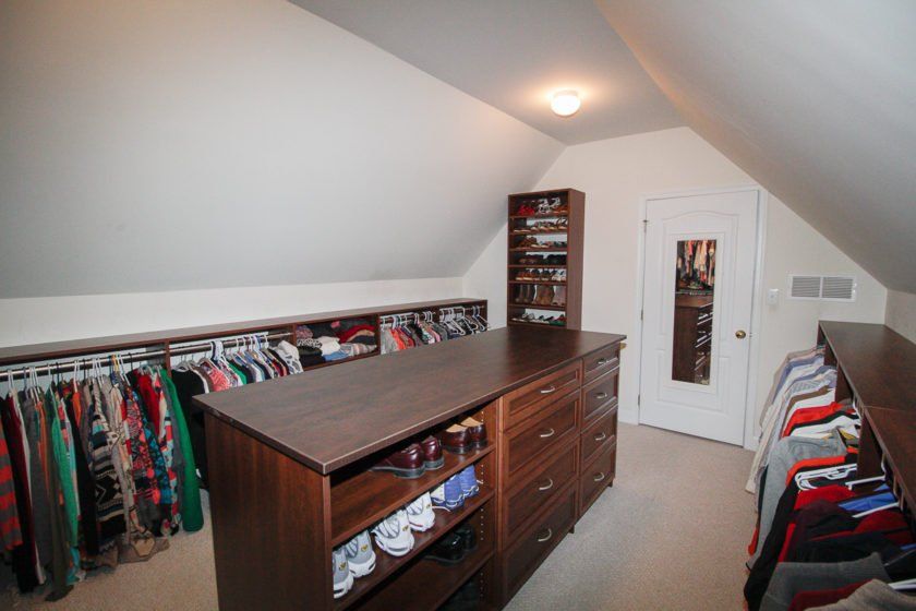 Bonus room conversion into a master closet with large island and plenty of hang along the long angled ceiling. Hunterdon County, NJ