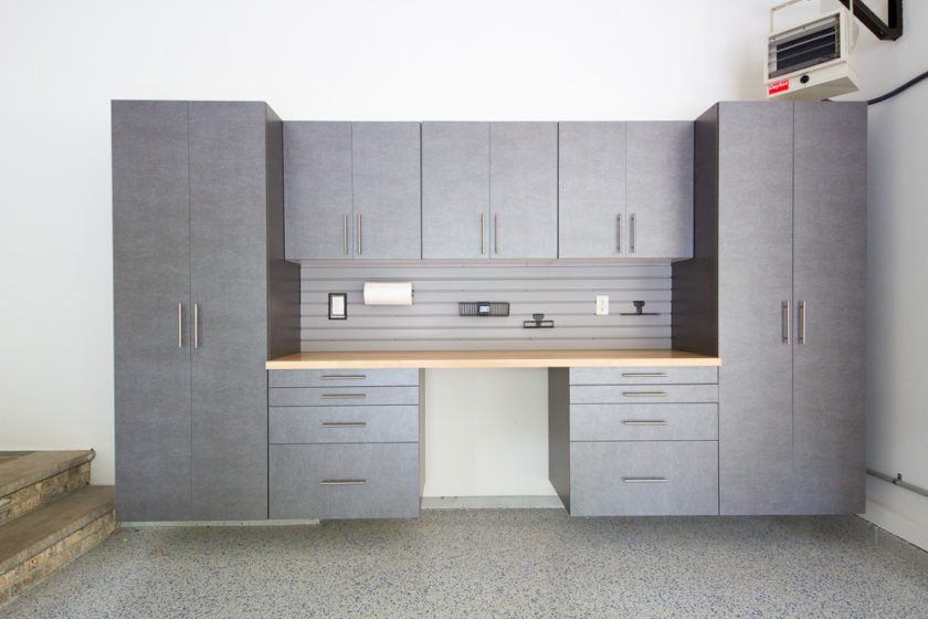 This functional, yet great looking, garage cabinetry includes maple workbench and plenty of storage.