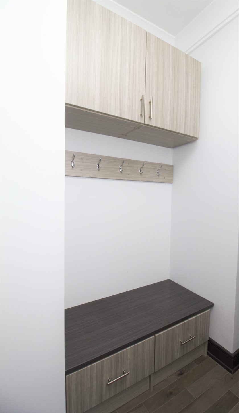 Small spaces can still be functional as shown in this mini mudroom in Westfield, NJ. Concrete color adds a contemporary look to complement the rest of the house.