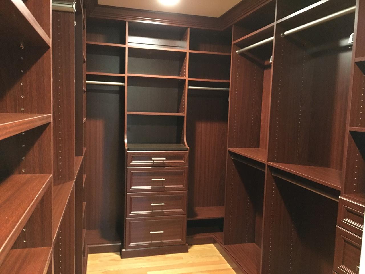 This mahogany walk-in closet system has drawers, hampers, wood backing, base and crown molding. - Westfield, NJ