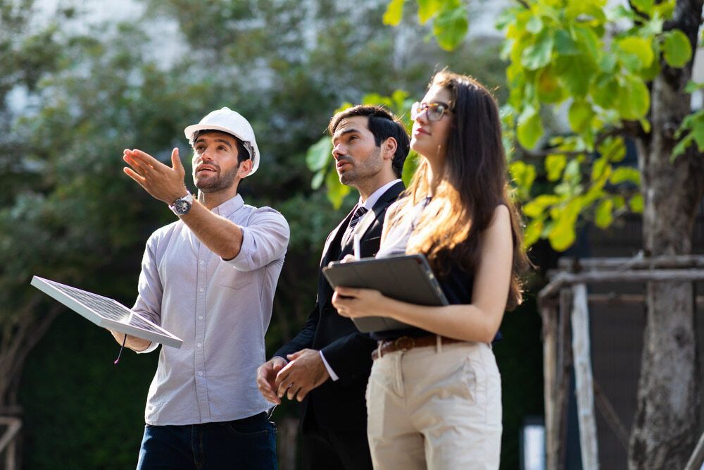 A Group Of People Are Standing Next To Each Other In A Park — RAFFBRO Electrical Solar & Air Conditioning In Wodonga, VIC