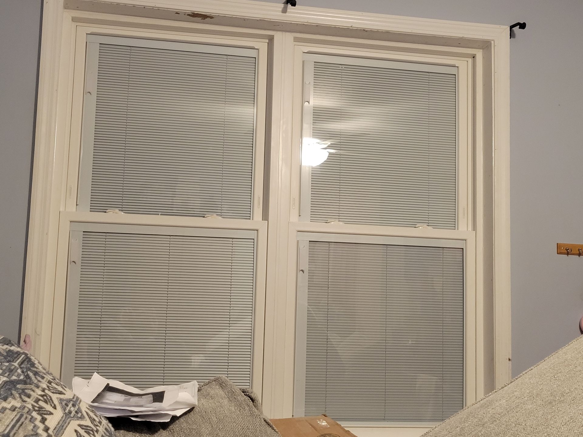 A window with blinds on it in a room
