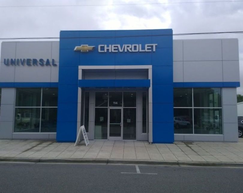 A chevrolet dealership with a blue and white facade