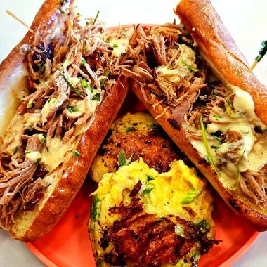 A plate of food with sandwiches and eggs on it