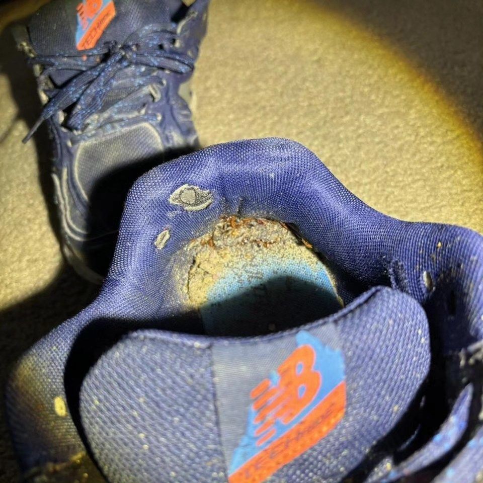 The inside of a pair of blue new balance shoes