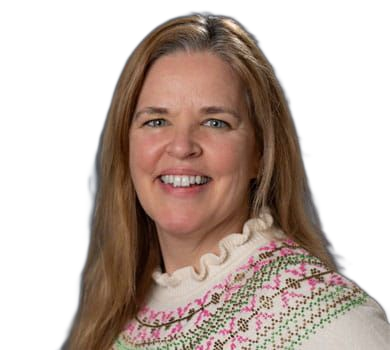 A woman with long blonde hair smiles, wearing a patterned sweater, against a blue background.