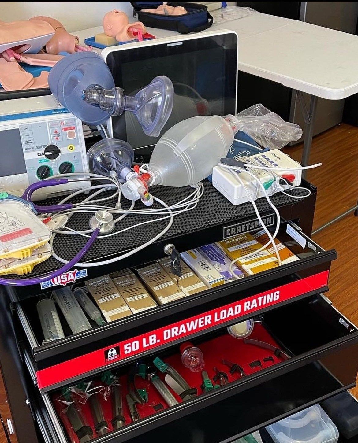 A drawer filled with a lot of medical equipment.