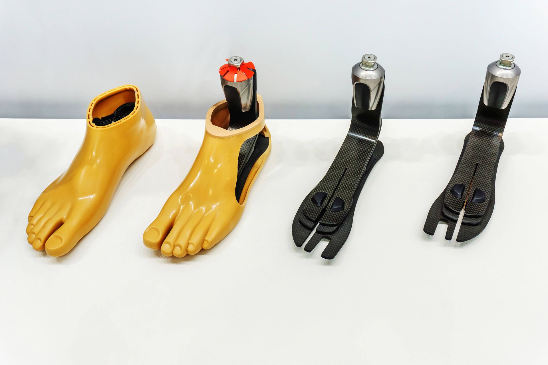 Four different types of prosthetic feet on a table near Edgewood, KY, and Lawrenceburg, IN