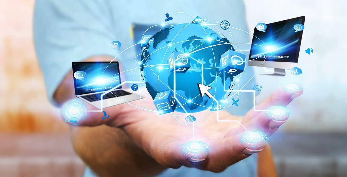 A person is fixing a computer with a pair of tweezers.