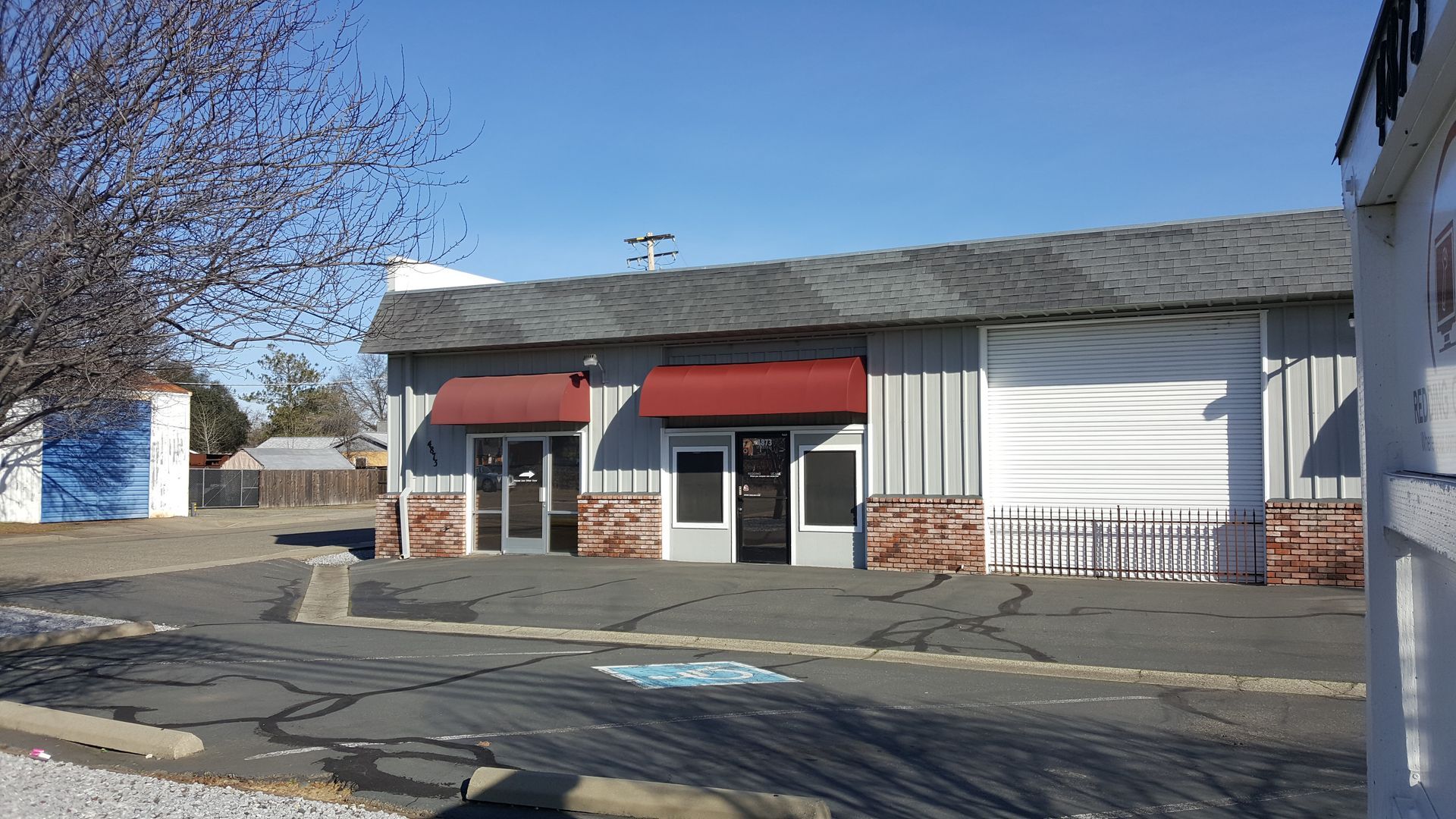 A building with a red awning on the front of it