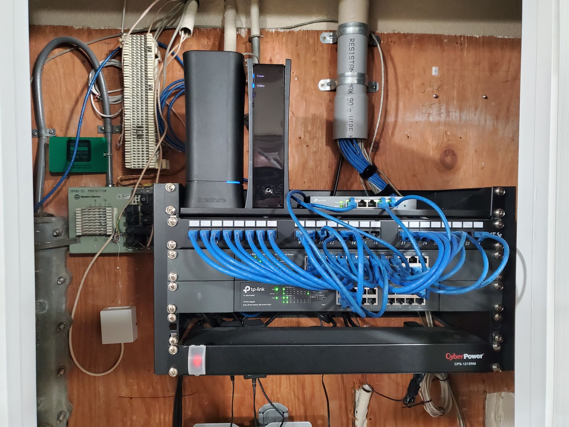 A bunch of wires are connected to a server in a box