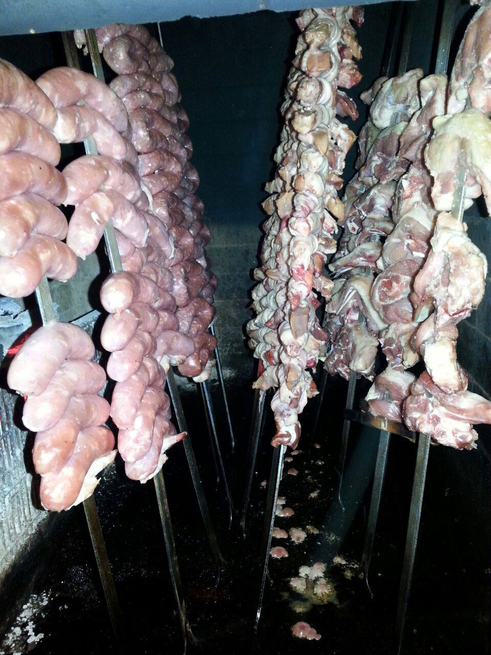 meat skewers cooked over the stove