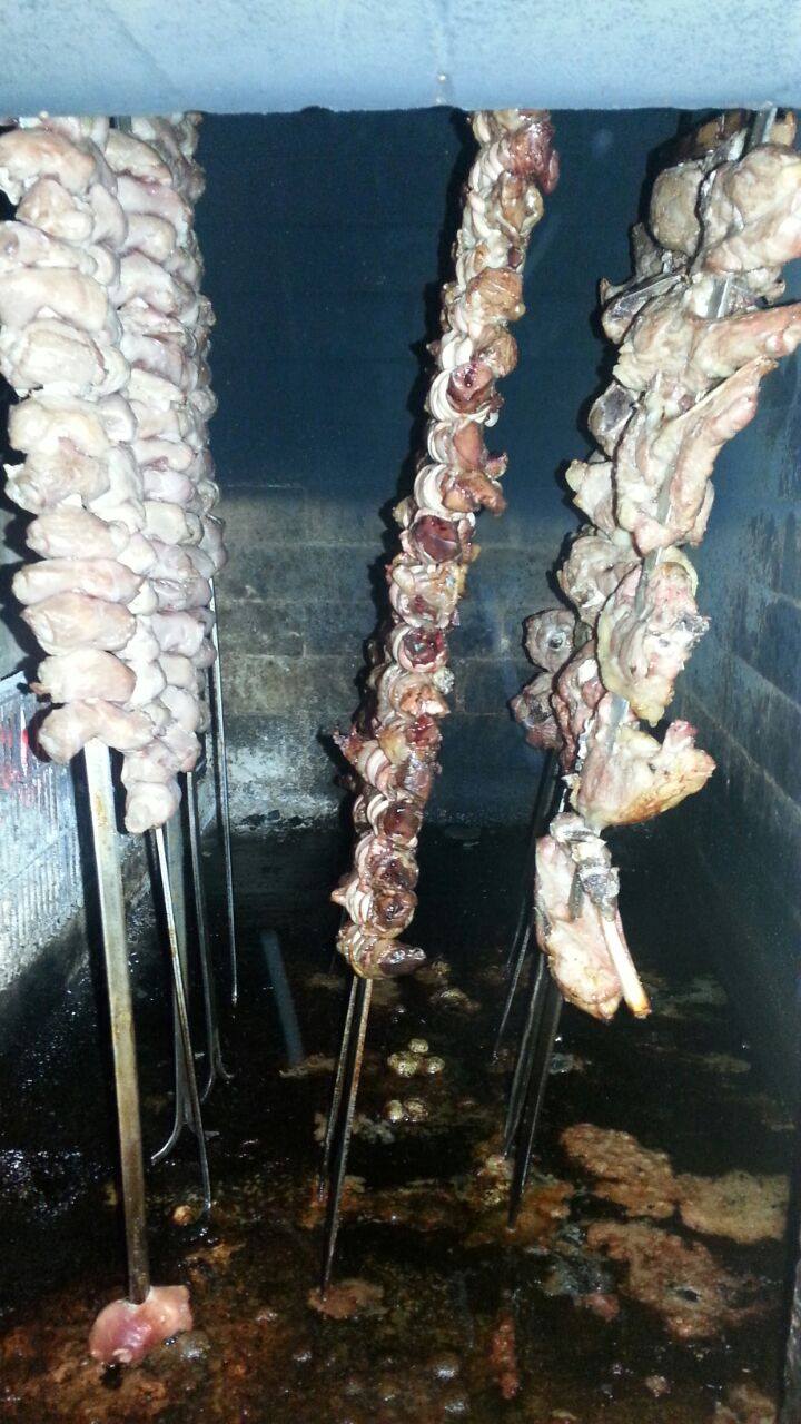 meat skewers cooked over the stove