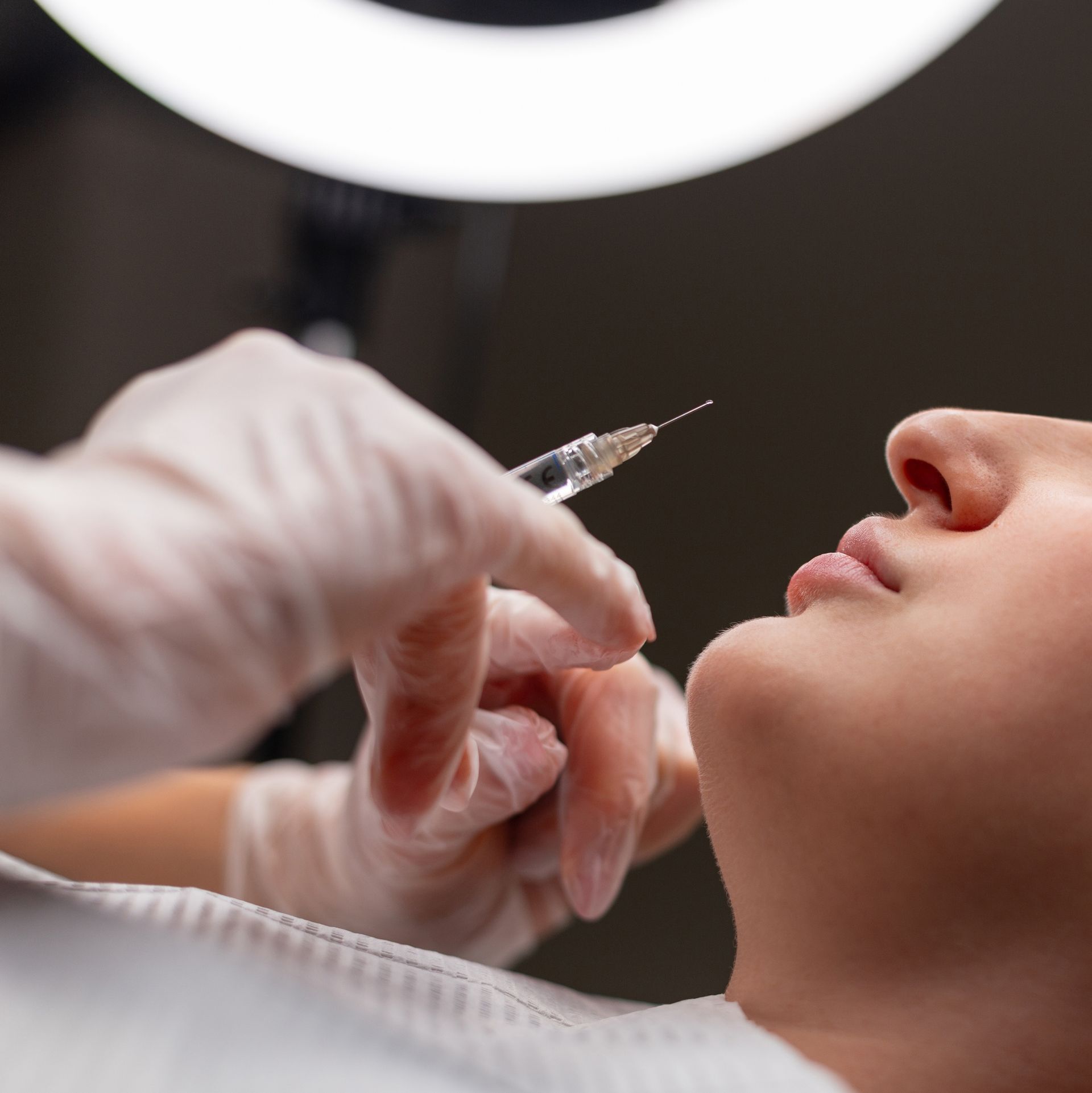 A person receiving a lip injection.