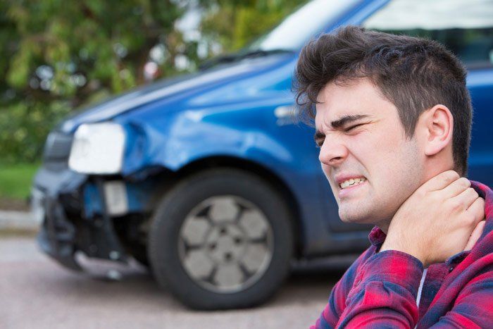 Man Suffering from Whiplash