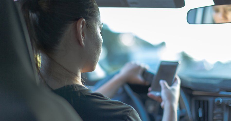 Woman Driving While Texting — Reno, NV — Erwin Thompson Faillers