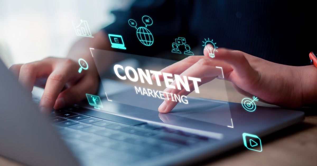 Person using a laptop, touching a screen with