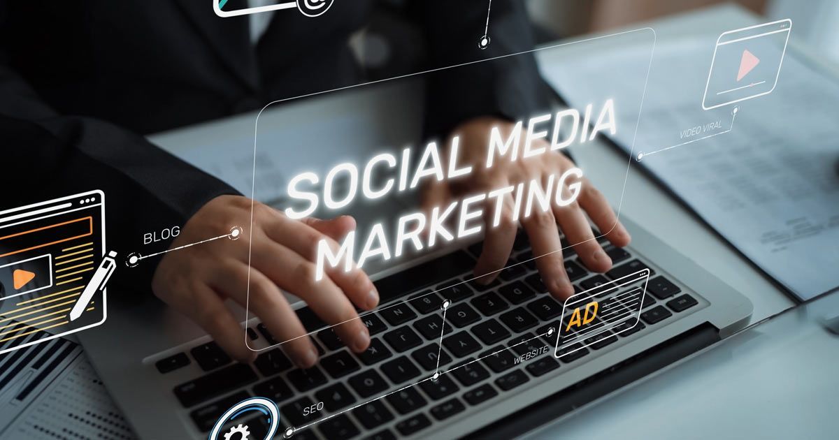 Hands typing on a laptop with overlaid 