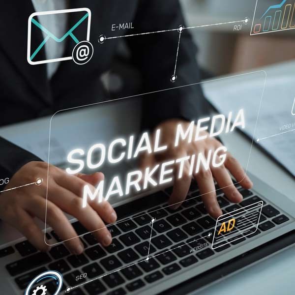 Person typing on laptop, overlaid with