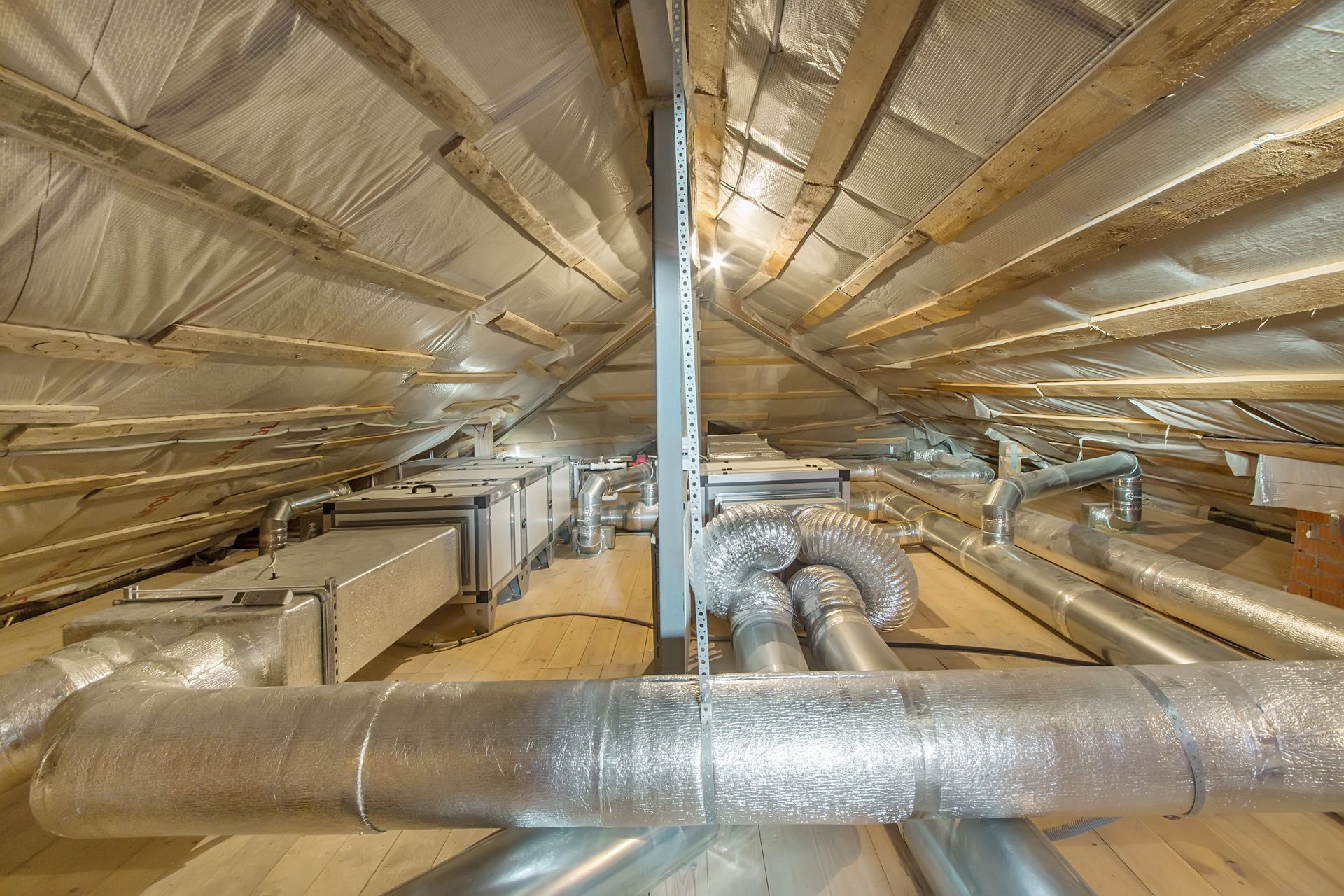 There are a lot of pipes in the attic.