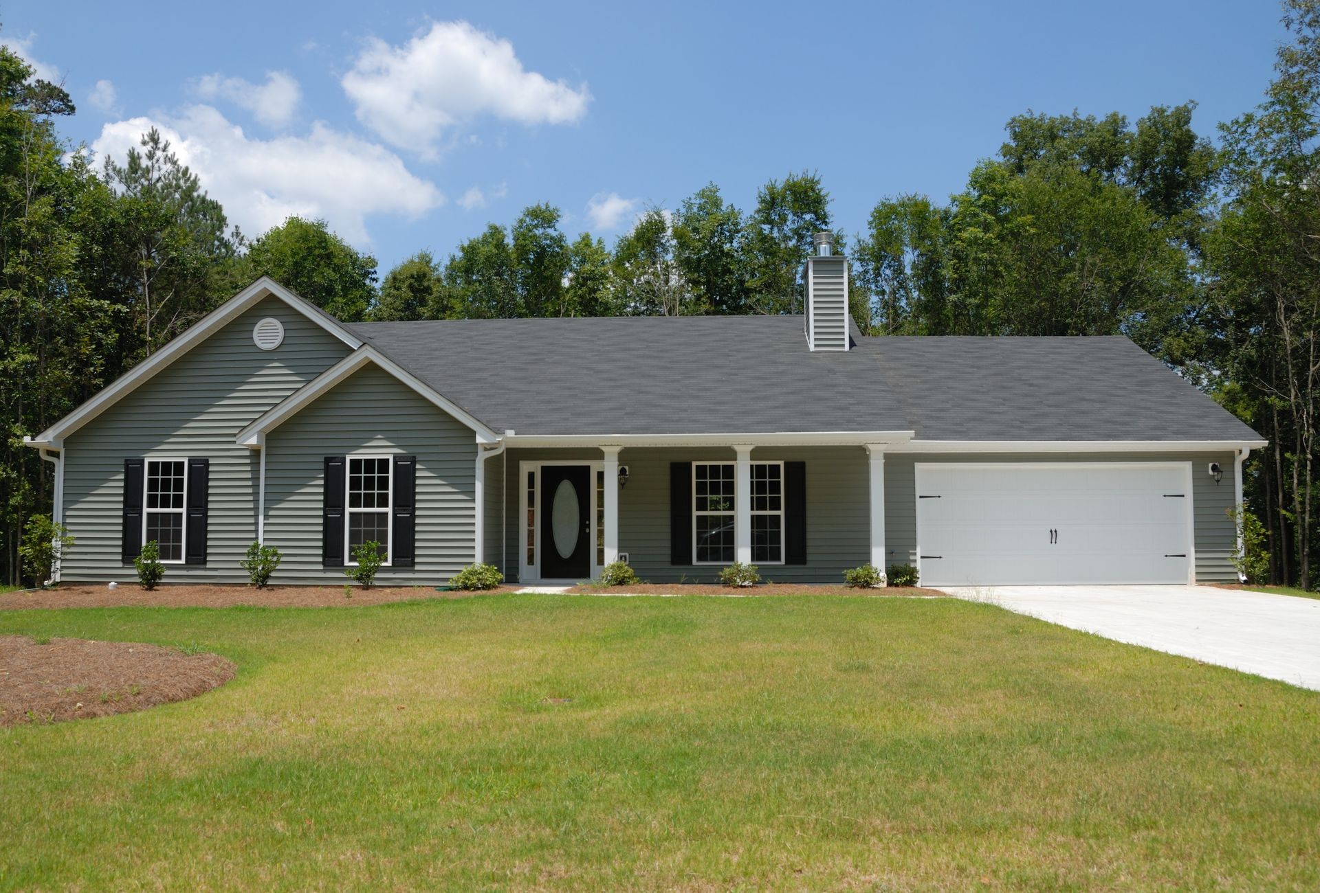 A house with a gray siding and black shutters in Georgia.