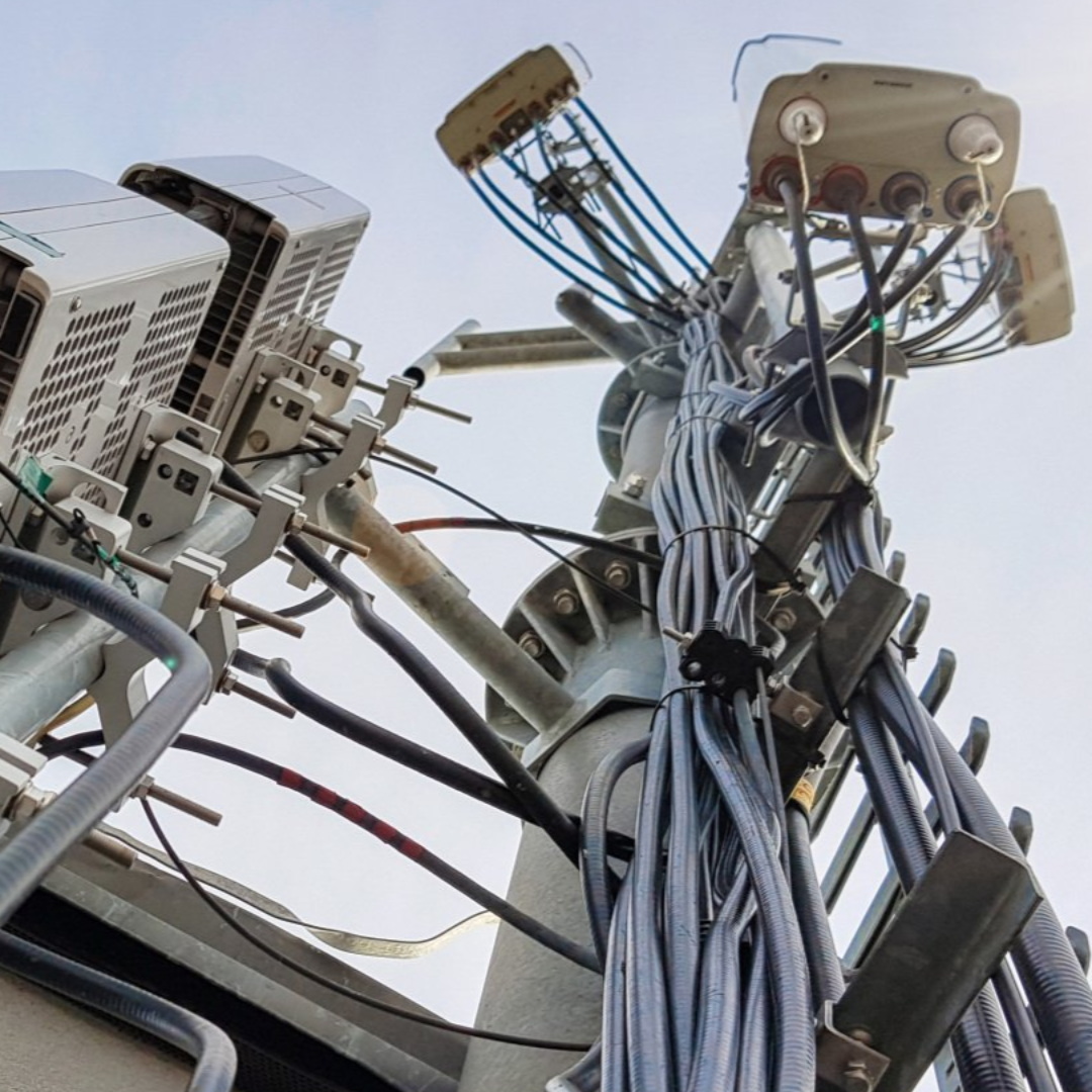 Upward view of cabling for a satellite antenna dish.