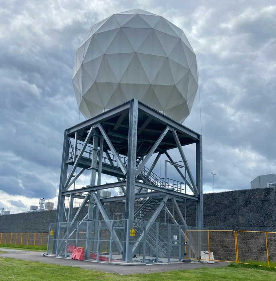 Elevated satellite antenna with satellite antenna covering