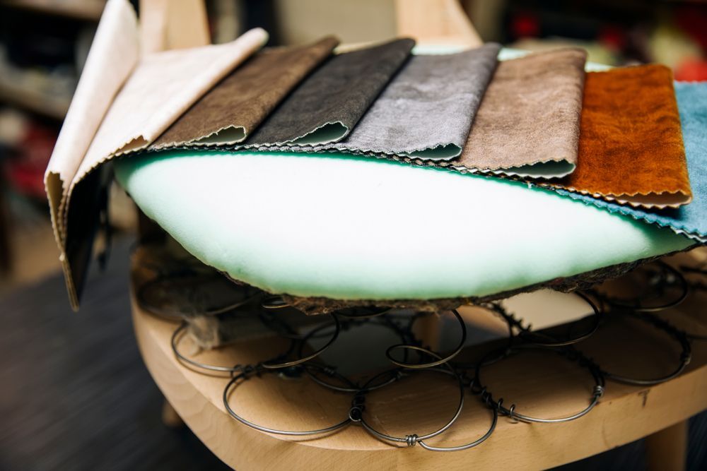 Upholstered Chair in Progress With Fabric Swatches — Atherton Decor Centre In Tolga, QLD