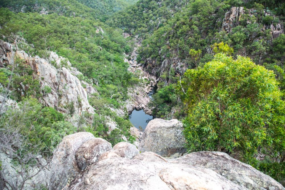 Rocky Canyon With Lush Green Trees and a Small Pool of Water — Atherton Decor Centre In Dimbulah, QLD
