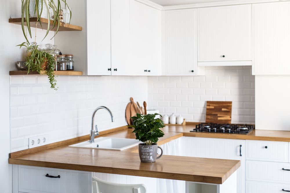 White Kitchen With Wood Countertops, Upper Cabinets — Atherton Decor Centre In Dimbulah, QLD