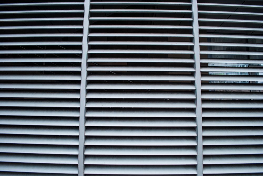 Gray Horizontal Blinds, Evenly Spaced, Covering a Window — Atherton Decor Centre In Malanda, QLD