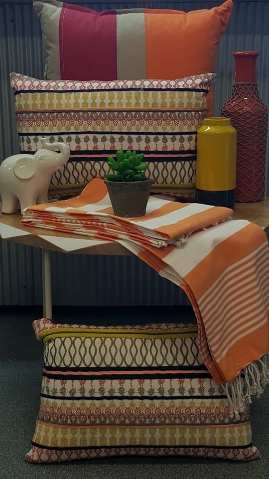 A Table With Pillows and a Plant on It — Atherton Decor Centre In Atherton, QLD