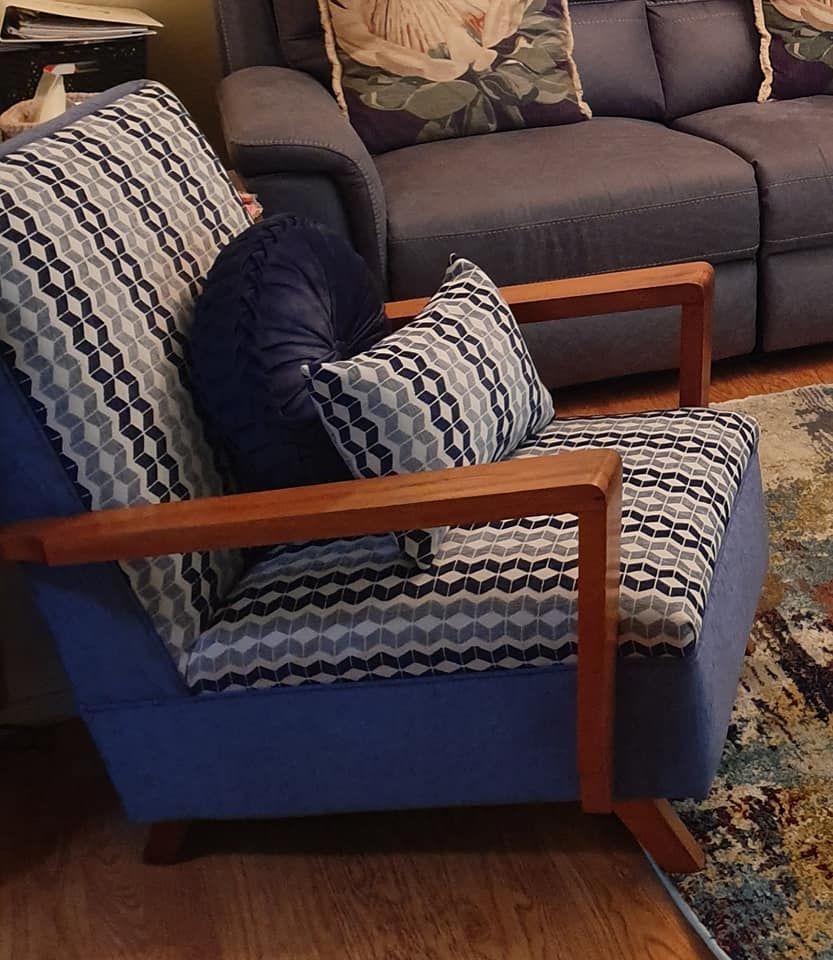 A Living Room With a Blue Chair and a Couch — Atherton Decor Centre In Atherton, QLD